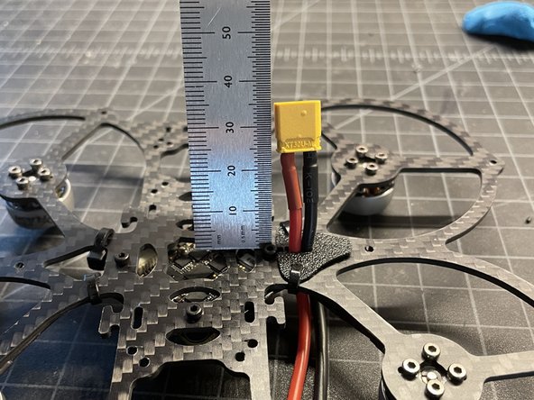 Insert VBAT leadwire thru grommet with approx 25mm extension (pic #1)