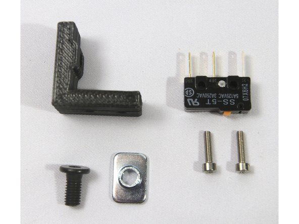 Locate the three endstop brackets in the printed parts box B and the Endstops &amp; Hardware bag. Also locate three T-nuts from the Frame Hardware bag.