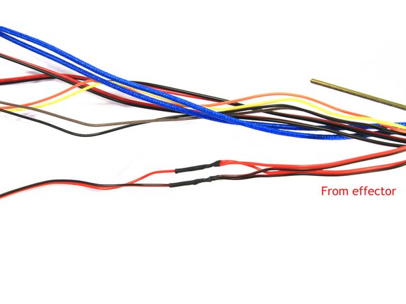 Clip both pairs of wires approximately 125 mm (5&quot;) from where they emerge at the top of the effector Zip Ties that hold the wire bundle in place. Discard one of the long pieces, the other will be used to tie the two fans together into one set of lead wires.