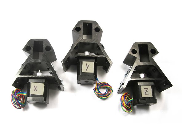 Orient the stepper and corner assemblies as shown. Label them X, Y and Z with a small piece of masking tape. Make sure the wiring harness is on the bottom for all three assemblies.