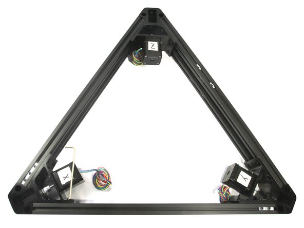 Starting with the rails attached to the Z assembly, slide them onto the Y assembly T-nuts until the first two T-nuts (one top and one bottom) are just hidden as shown in the second photo.