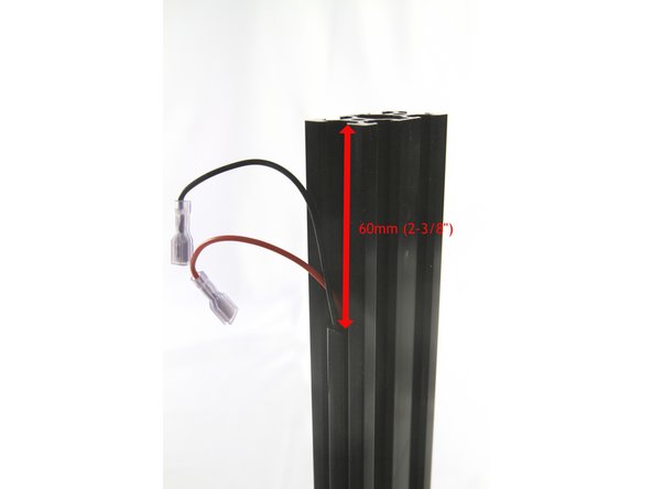 Continue installing the T-slot cover in the slot until you reach near the top. Cut the T-slot cover 60mm (2-3/8&quot;) from the end of the tower as shown.