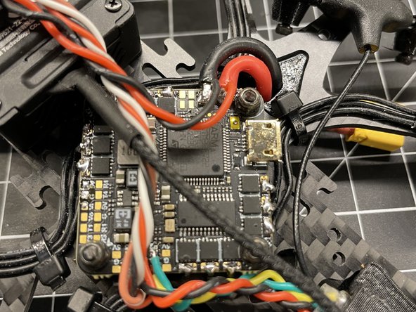 You will have to burn away the adhesive over the LED contacts with the solder iron before tinning the pads and attaching the lead wires