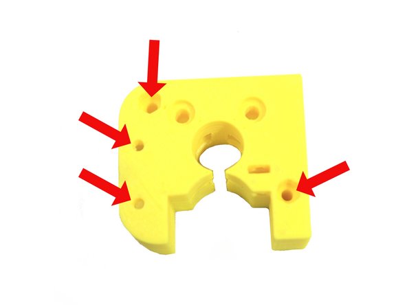 Use a 3mm to ream the four holes in the extruder body shown in the first photo.