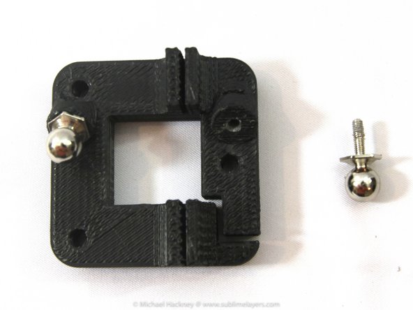 Once the nut is in place, use a 2mm Allen wrench to make sure the nut is aligned with the hole in the carriage.