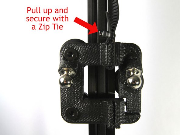 Insert the end of the belt into the slot nearest the top of the carriage. Note that the belt teeth must face inward as shown in the second photo. Leave about 40mm (1.5&quot;) of belt extending from the bottom of the slot.