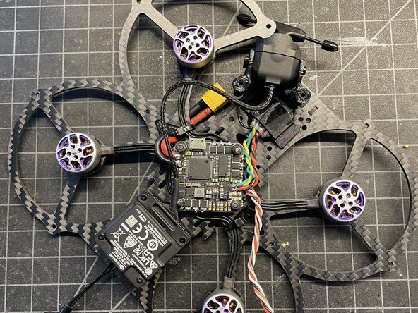 Trim twisted wires to length. Cut approx 2mm insulation &amp; pre-tin wires. Solder wires to FC as shown