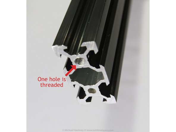 Locate the threaded hole at one end of each of the three tower extrusions. Mark it with a small piece of masking tape.