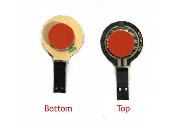 Prepare the three FSRs by adhering a silicone pad to the center of the top and bottom of the pad as shown in the first photo.