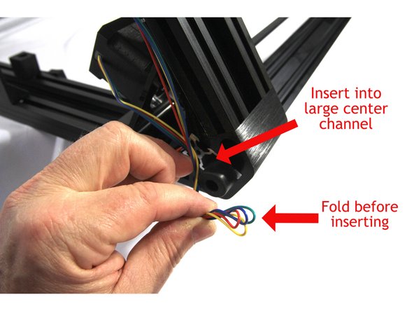 Secure the Z stepper motor wires with another large Zip Tie as shown by the blue arrow.
