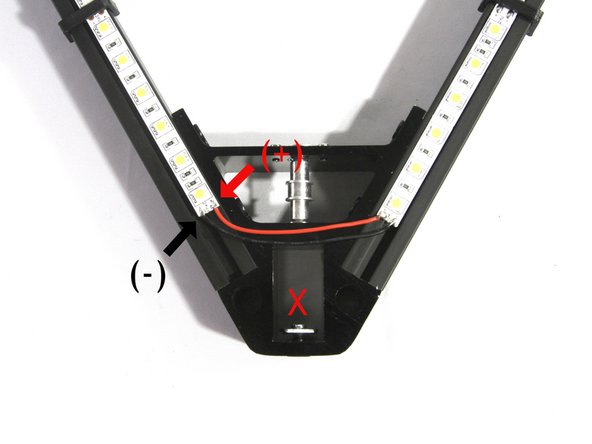 Strip 2mm (1/8&quot;) of insulation from the end of the 200mm red and black wires you saved from Step 32. Tin the ends of the wire with solder.