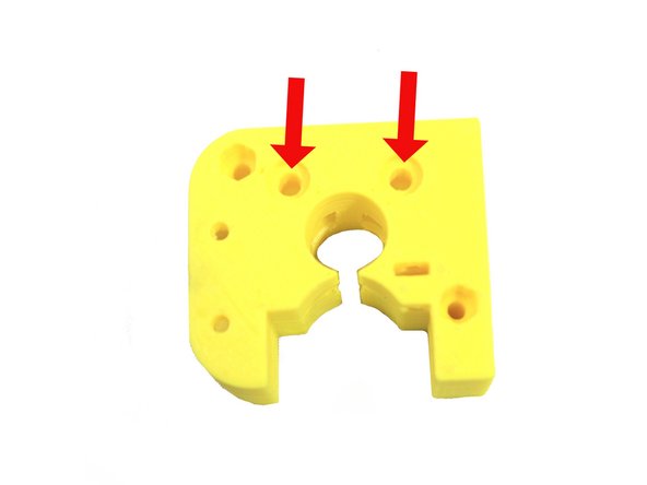 Ream the two bearing screw holes in the extruder body with a 4mm drill.