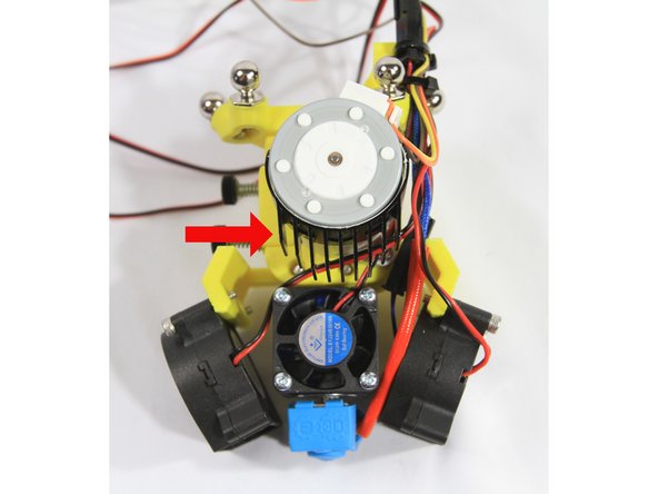 Remove the paper protective film from the Akasa Heat Tape and apply the tape to the inside of the heat sink. Trim the excess tape off with an X-acto knife.