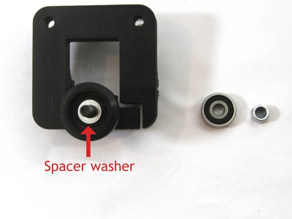 The spacer is the 9mm long aluminum spacer, spacer washer is the 1mm thick washer.