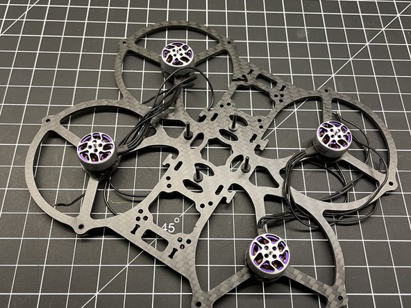 Insert M2x16 Button Head screws X4 in frame as shown and add plastic washers if needed for FC clearance.