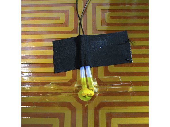 Use a little dab of the heat sink compound left over from assembling the E3D V6 hot end as shown in the second photo.