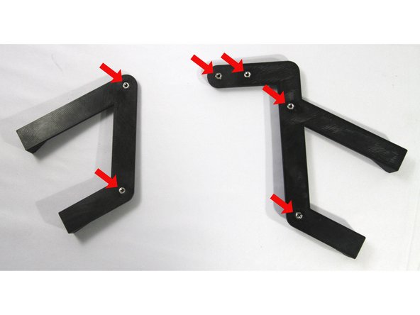 Clear out the six holes in the Duet Wifi Mounts if needed. Then insert six M3 Nuts in the pockets on the backside of the mount as shown in the second photo.