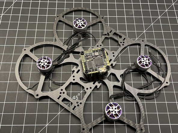 Insert M2x16 Button Head screws X4 in frame as shown and add plastic washers if needed for FC clearance.