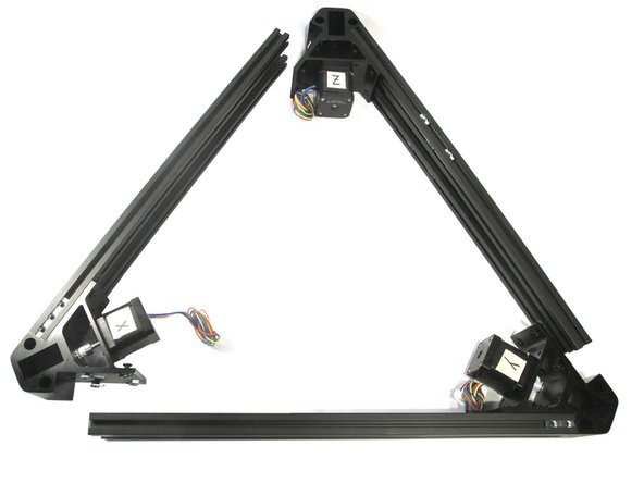 This step is like stuffing an octopus into a Mason jar – but we'll try to make it easier for you. The object is to get the T-nuts on all three corner brackets to slide into the cross member slots as uniformly as possible.