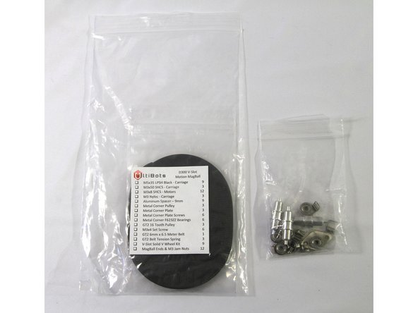 Locate the Motion MagBall hardware bag and remove the small bag containing the metal corner pulley hardware.