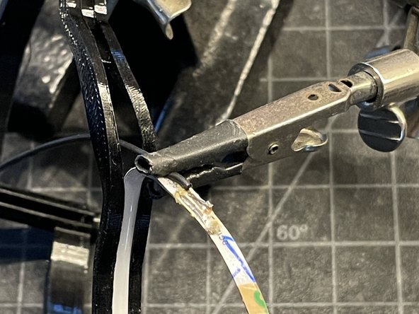 FIND THE MIDDLE LED +/- CONDUCTOR TERMINALS AND POSITION THE LED COB STRIP IN THE MOUNT SO THE LEADS ARE CENTERED IN THE TPU MOUNT
