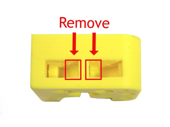 Remove the two highlighted support structures. These are easiest to remove through the openings exposed in the previous step as shown here.