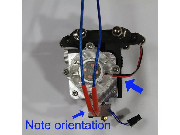 Install the fan with it's wiring harness oriented as shown in the second photo.