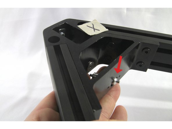 Now maneuver the corner pulley into place. As shown in the photos, you can push one end though the corner bracket cross piece hole and then insert the corner pulley into the flanged bearing.