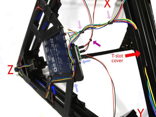 For this step I laid the printer on its &quot;right&quot; side - the Y-Z towers are on the table. Zip Ties installed in the Step 67 are shown as lighter ghost arrows.
