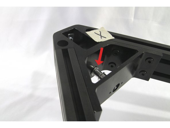 Now maneuver the corner pulley into place. As shown in the photos, you can push one end though the corner bracket cross piece hole and then insert the corner pulley into the flanged bearing.