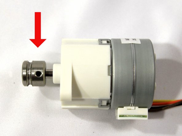 Install the drive gear on the stepper motor shaft with the set screw closest to the motor as shown in the photo.