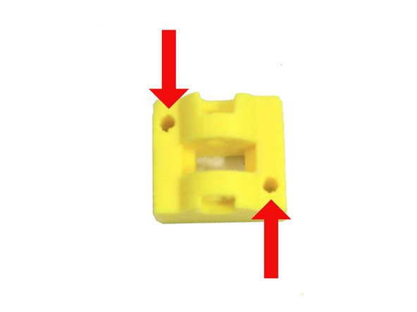 Ream the two holes in the idler.