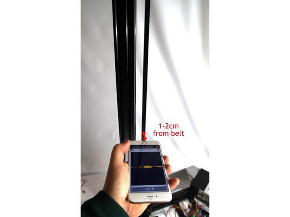 Using your thumbs or a helper, push UP on the top unit to tension the belt. Tighten the screws securely.