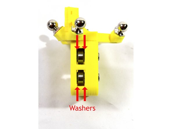 Attach the bearing with an M4x20 SHCS and M4 nut as shown in the second photo,