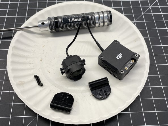 Remove camera mounting screws and push them into the TPU mounts (pic #2)