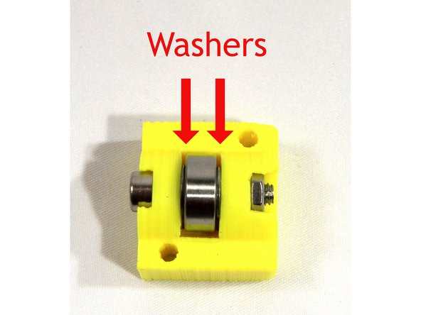 Use an Allen wrench to align the washers with the bearing hole and the holes in the idler.