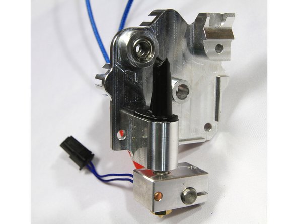 Install the filament guide for 1.75mm filament as shown in the second photo. The guide must sit flush on the machined aluminum surface.