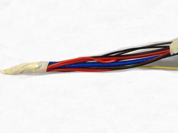 Gather all of the wires in the whip and clip them all to the length of the shortest wire so they are all the same length as shown in the first photo.