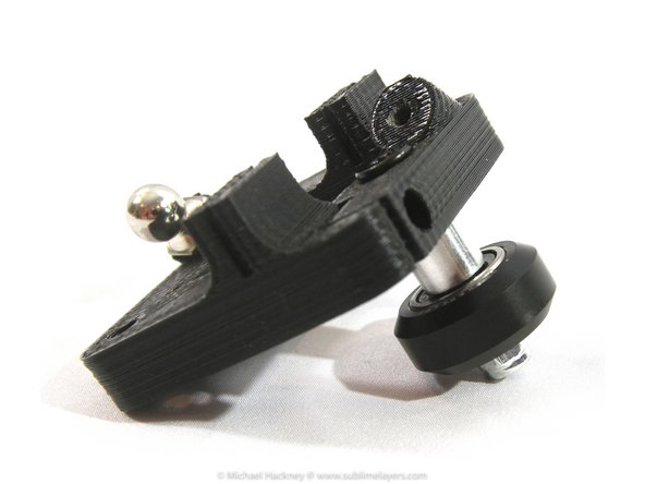 Complete the wheel assembly by inserting the second bearing and then screw on the lock nut. Tighten the nut with an 8mm wrench and 3mm Allen wrench.