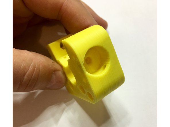 Carefully look over both the extruder body and the idler and trim off and clean up any plastic remnants.