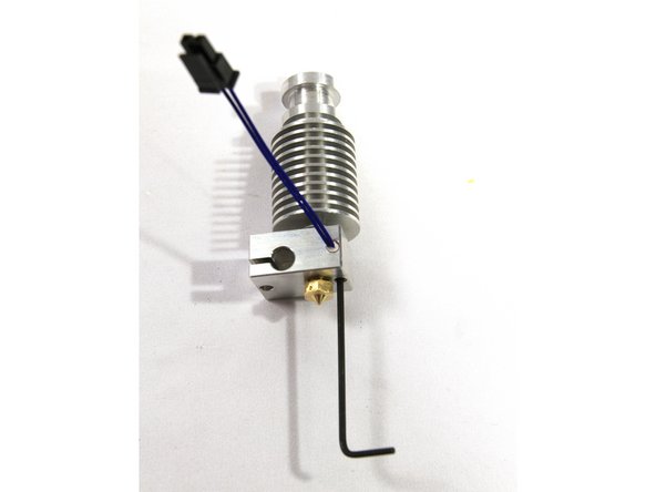 Install the thermistor cartridge in the heater block. The wires should protrude from the side shown in the first photo. The set screw and small Allen wrench are included in the E3D V6 hot end kit. Tighten the set screw until it just touches the cartridge then do one more 1/2 turn.