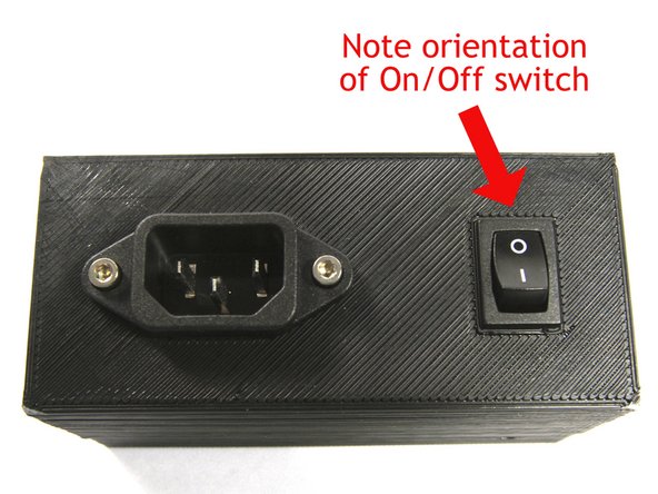 Install the IEC Receptacle using two M3x10 Socket Head Cap Screws.