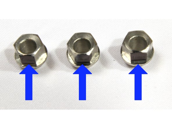 Locate the three eccentric spacers. Mark the surface closest to the offset hole with a black marker as shown in the first photo. It may also already have text on it.