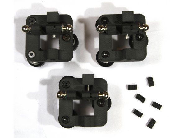 Slide the tensioner into the dovetail slot at the top of the carriage.