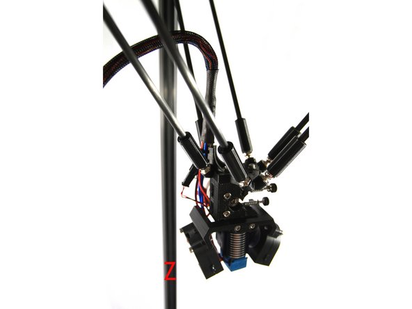 Locate the magnetic ball arms, they are packed in a protective cardboard wrap.