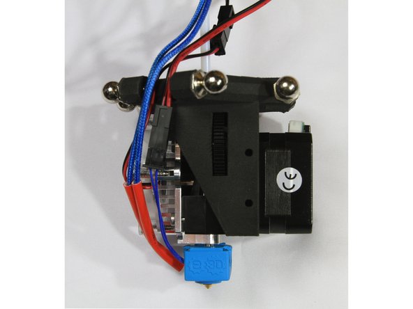 Route the wiring between the ball studs as shown in the third photo.