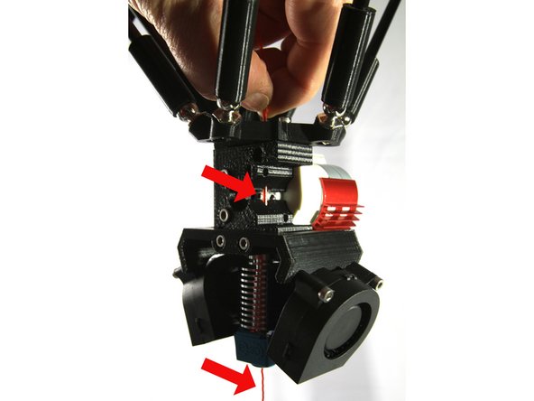 Put a mark on the extruder drive gear with a black permanent marker as shown in the first photo. This will help you observe the extruder's rotation and rotational direction.