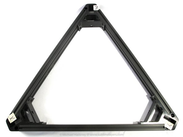 Starting with the rails attached to the Z assembly, slide them onto the Y assembly T-nuts until the first two T-nuts (one top and one bottom) are just hidden as shown in the second photo.