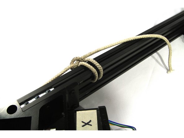 Now you are going to pull together and align the base. Although not difficult, this is a critical step. If you tighten the base with a twist or obvious gaps at the end of the cross members, the printer will be difficult to calibrate. Follow these steps and you will not have a problem.