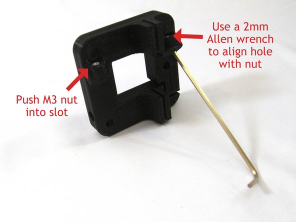 Install the two M3 nuts into the carriage slots. This can be tricky but you can align the nut and then push it in with a small screwdriver.